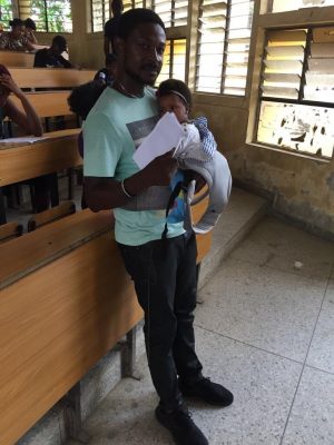 University Of Calabar Lecturer Seen Babysitting Student's Twins During An Exam  