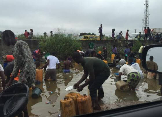 Nigerians Struggle To Scoop Fuel From A Tanker That Spilled Its Content In Lagos (VIDEO)  