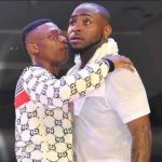 Loving Both Davido And Wizkid Will Not Kill You – Rapper Erigga Advises Fans  