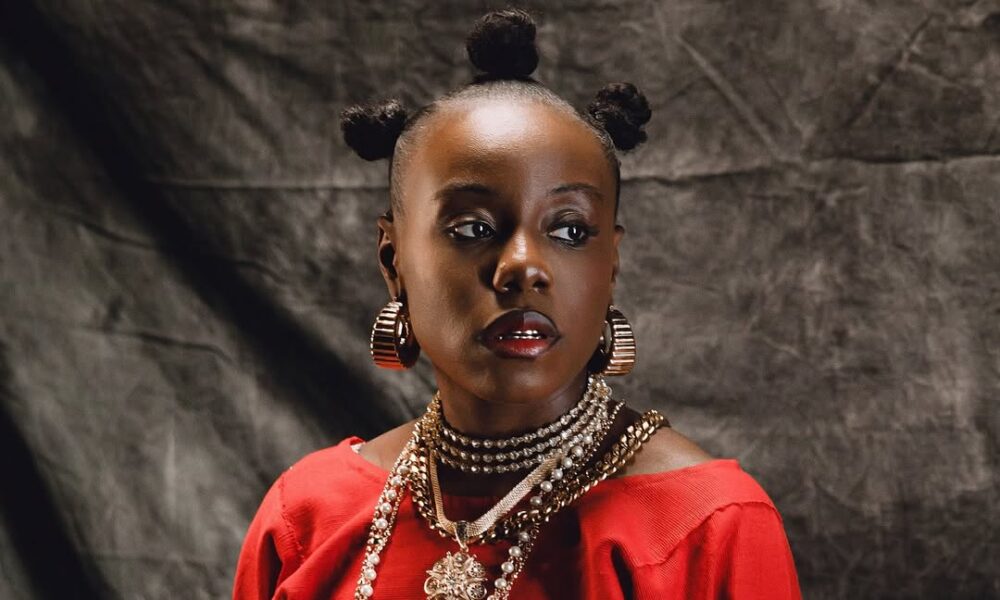 Teni Serves Pure Red Energy in 'Zion' Video With Olamide  